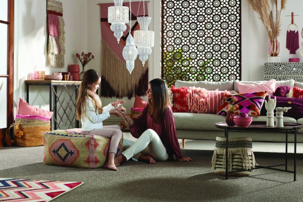 Mother and daughter in carpeted lounge