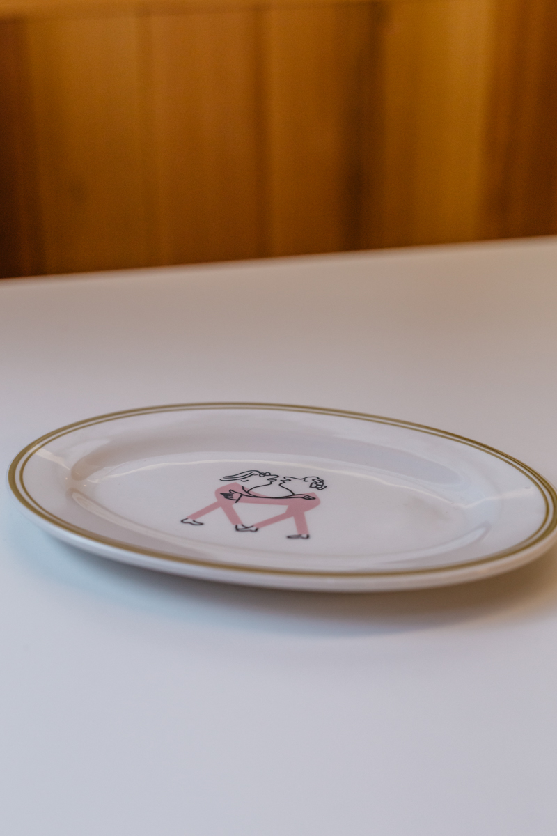 Photo of oval plate featuring Part Time Lover illustrator – Alec Doherty's work